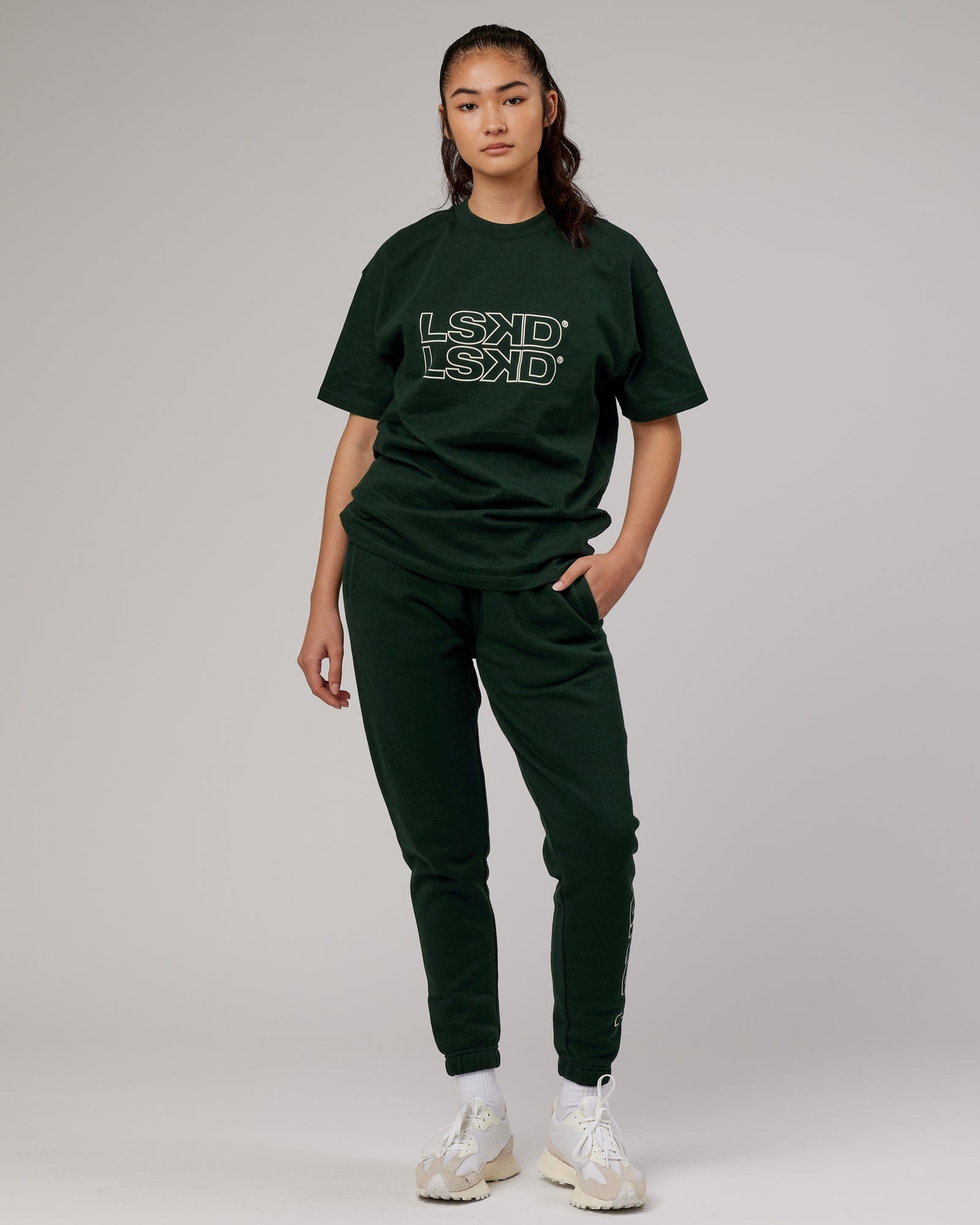 Model wearing Unisex Stacks Up Track Pant - Forest