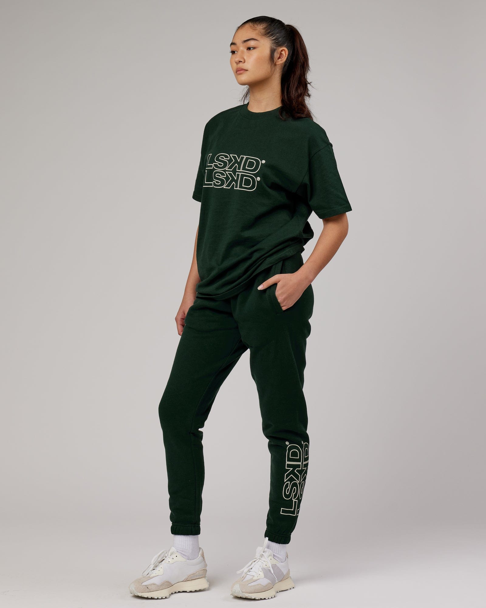 Model wearing Unisex Stacks Up Track Pant - Forest