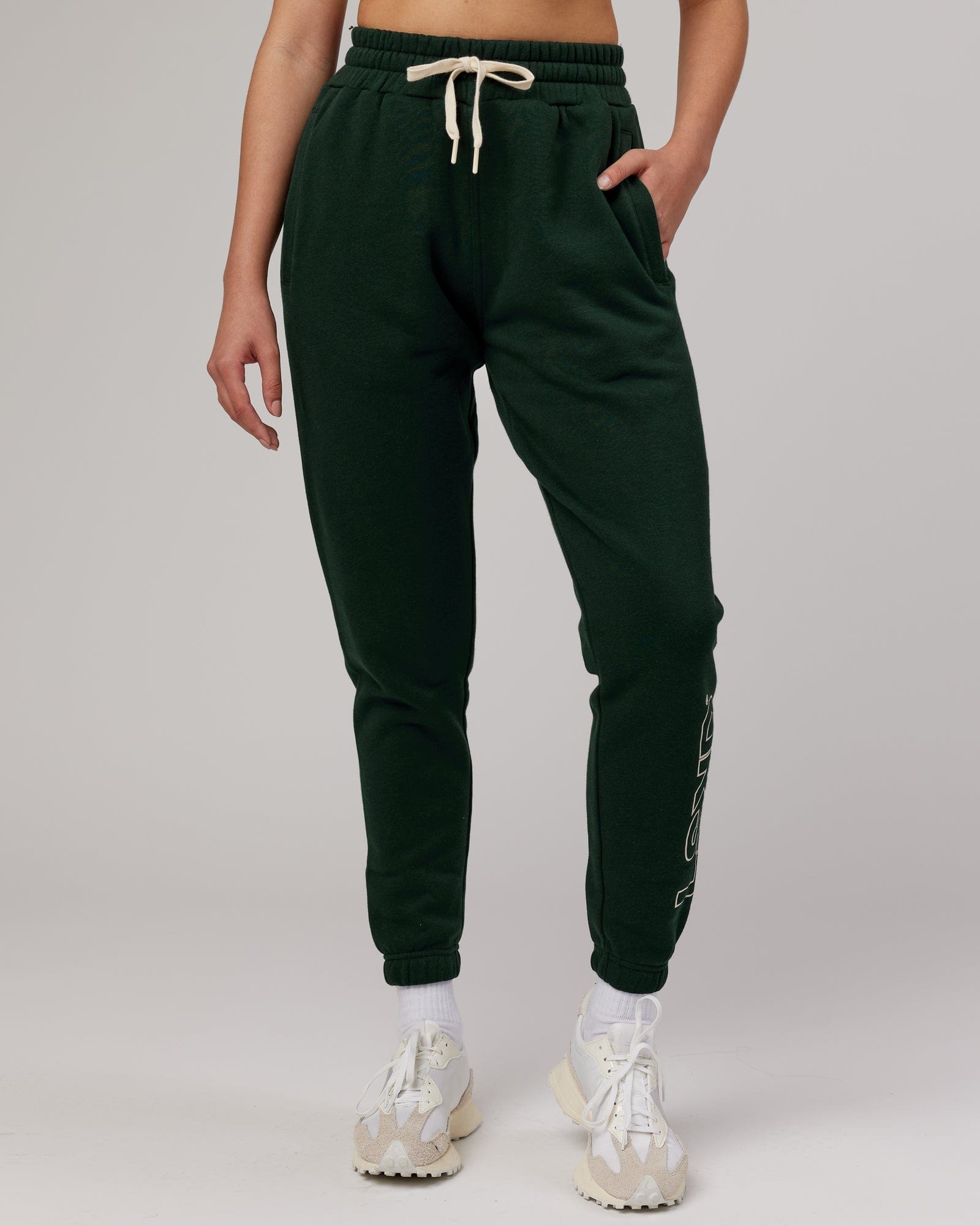 Model wearing Unisex Stacks Up Track Pant - Forest