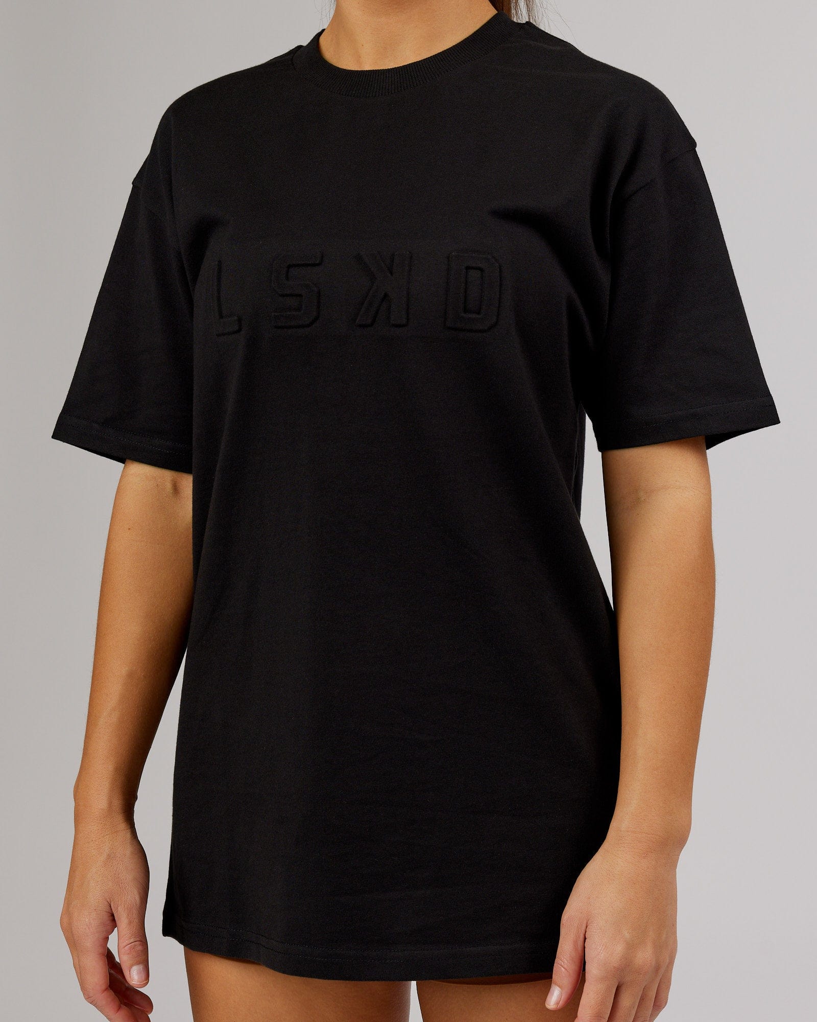 Model wearing Unisex Stamped Heavyweight Tee Oversize - Black