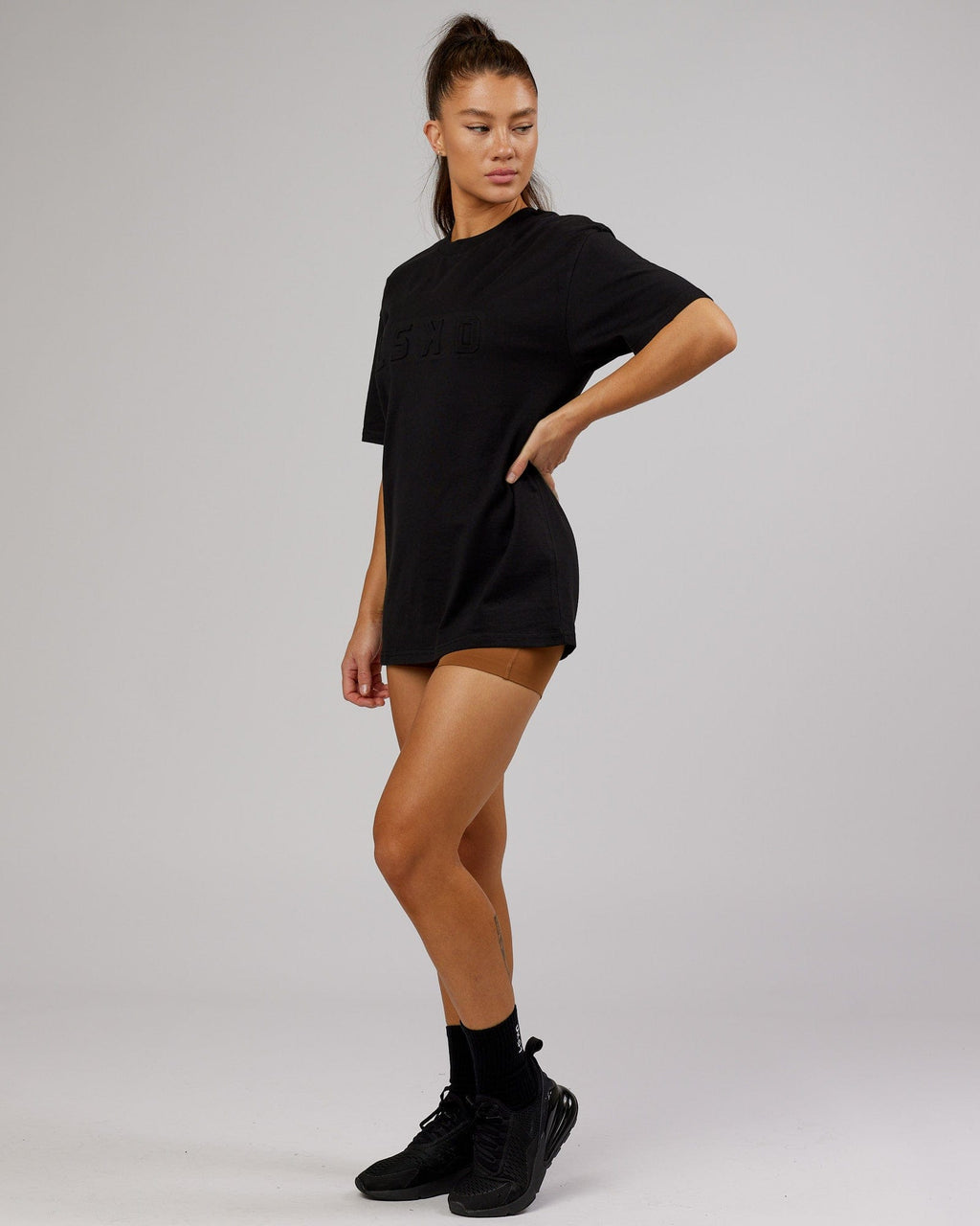 Model wearing Unisex Stamped Heavyweight Tee Oversize - Black