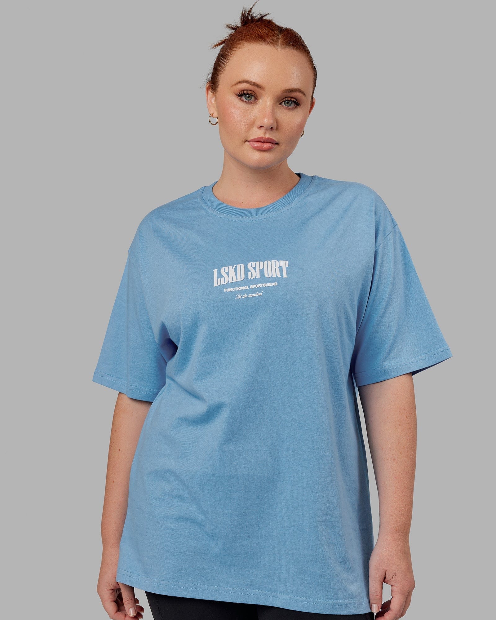 Model wearing Unisex Standard Heavyweight Tee Oversize - Azure Blue