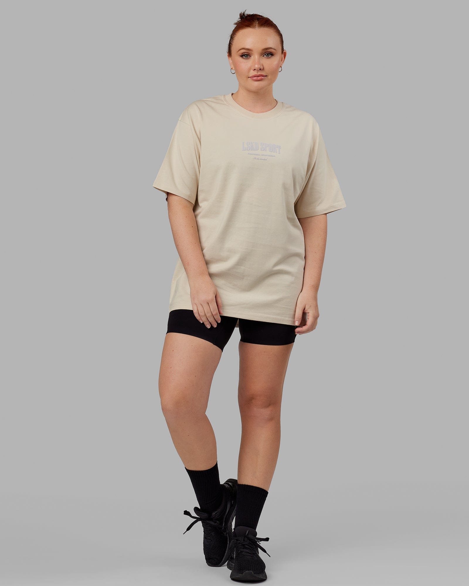 Model wearing Unisex Standard Heavyweight Tee Oversize - Bone