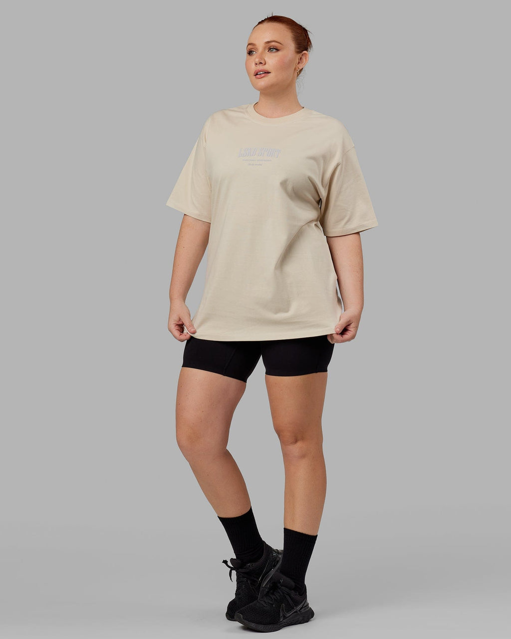 Model wearing Unisex Standard Heavyweight Tee Oversize - Bone