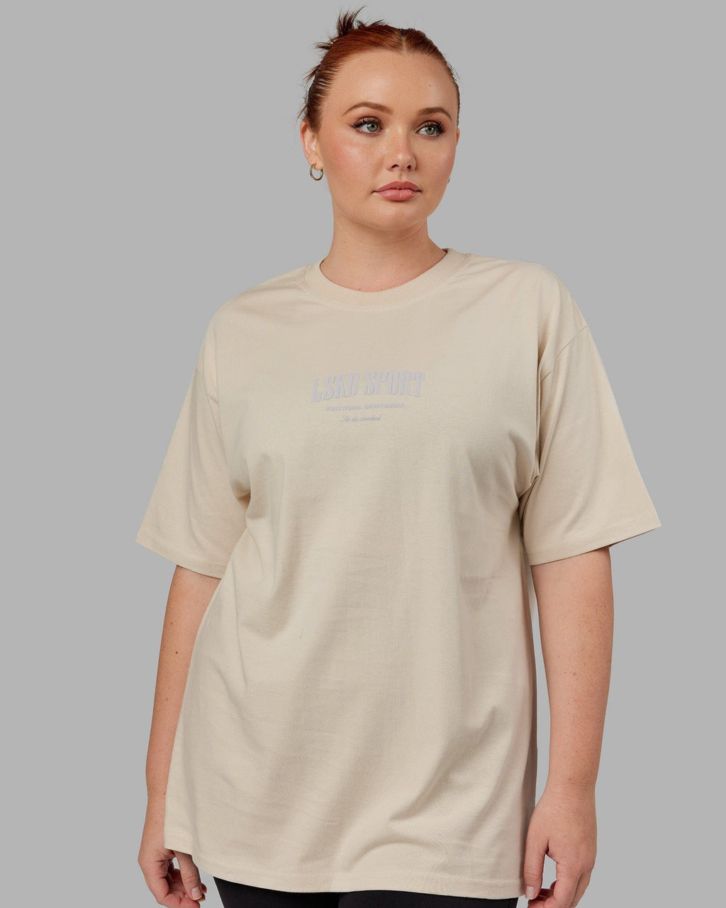 Model wearing Unisex Standard Heavyweight Tee Oversize - Bone
