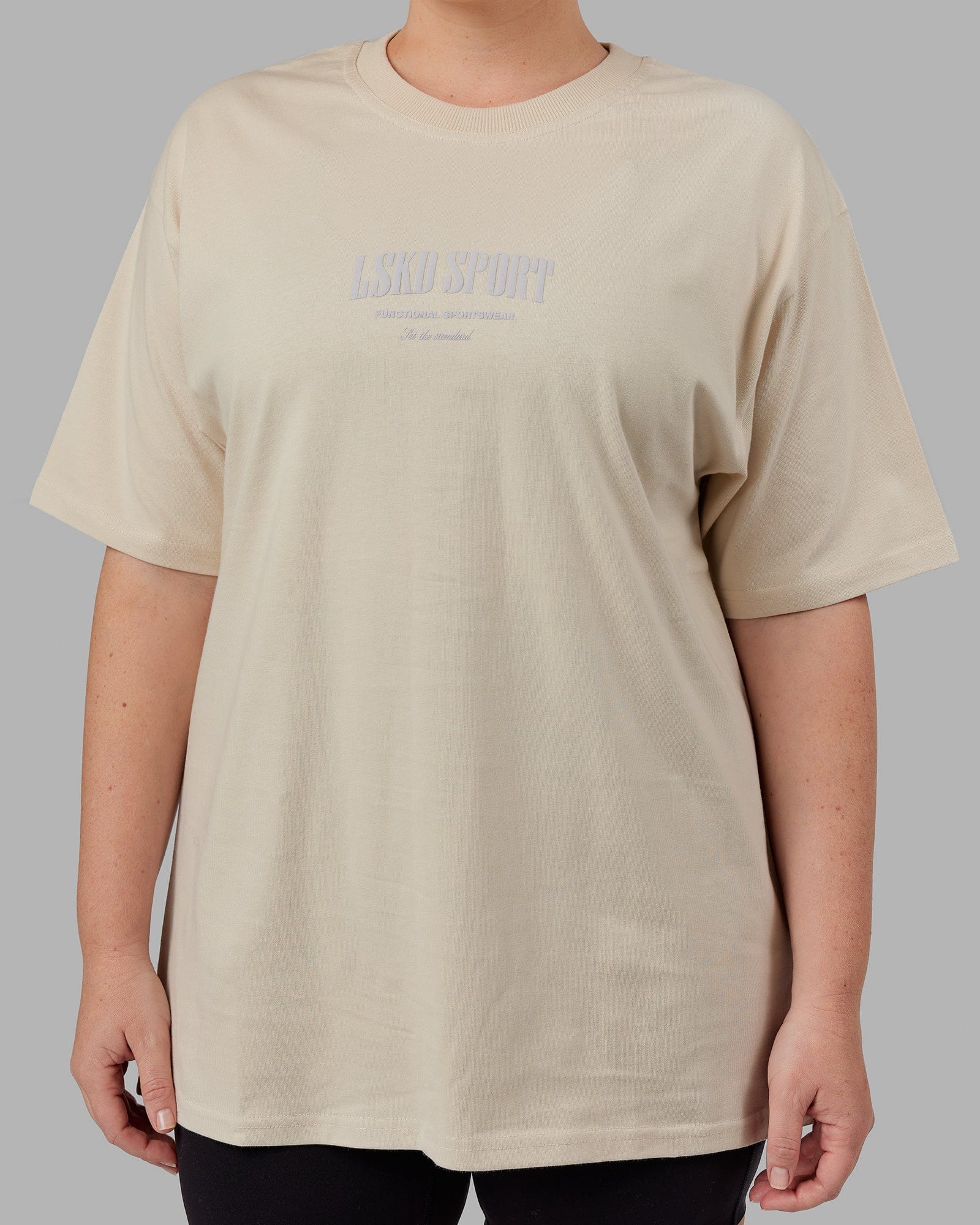 Model wearing Unisex Standard Heavyweight Tee Oversize - Bone