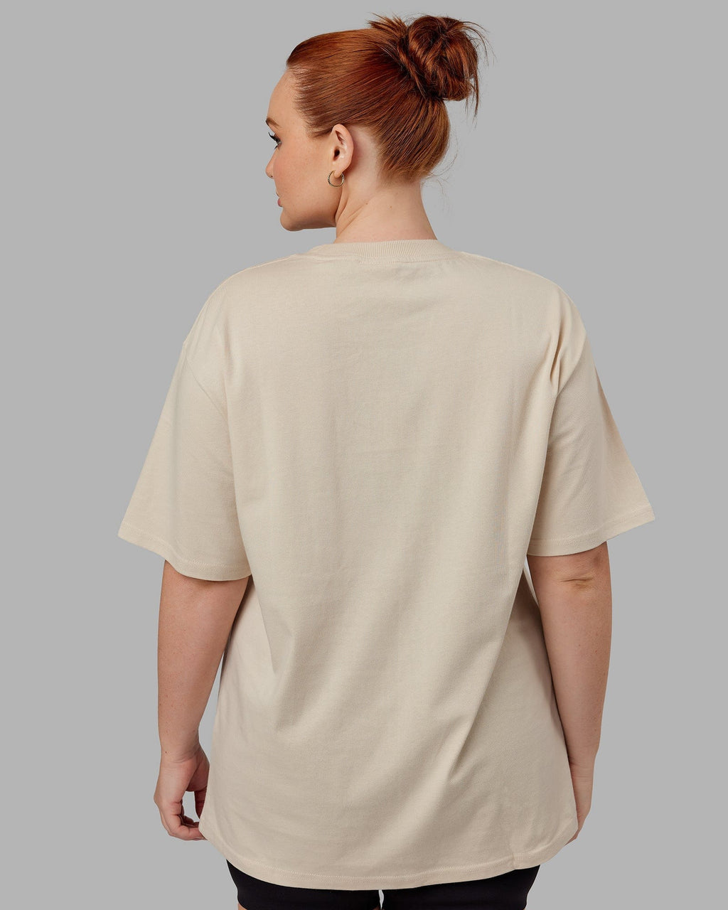 Model wearing Unisex Standard Heavyweight Tee Oversize - Bone