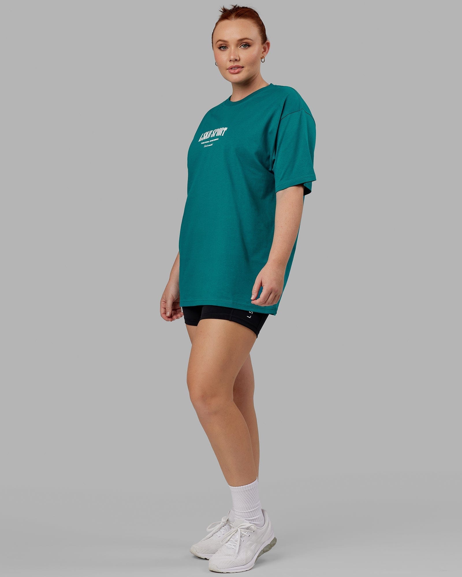 Model wearing Unisex Standard Heavyweight Tee Oversize - Deep Lake