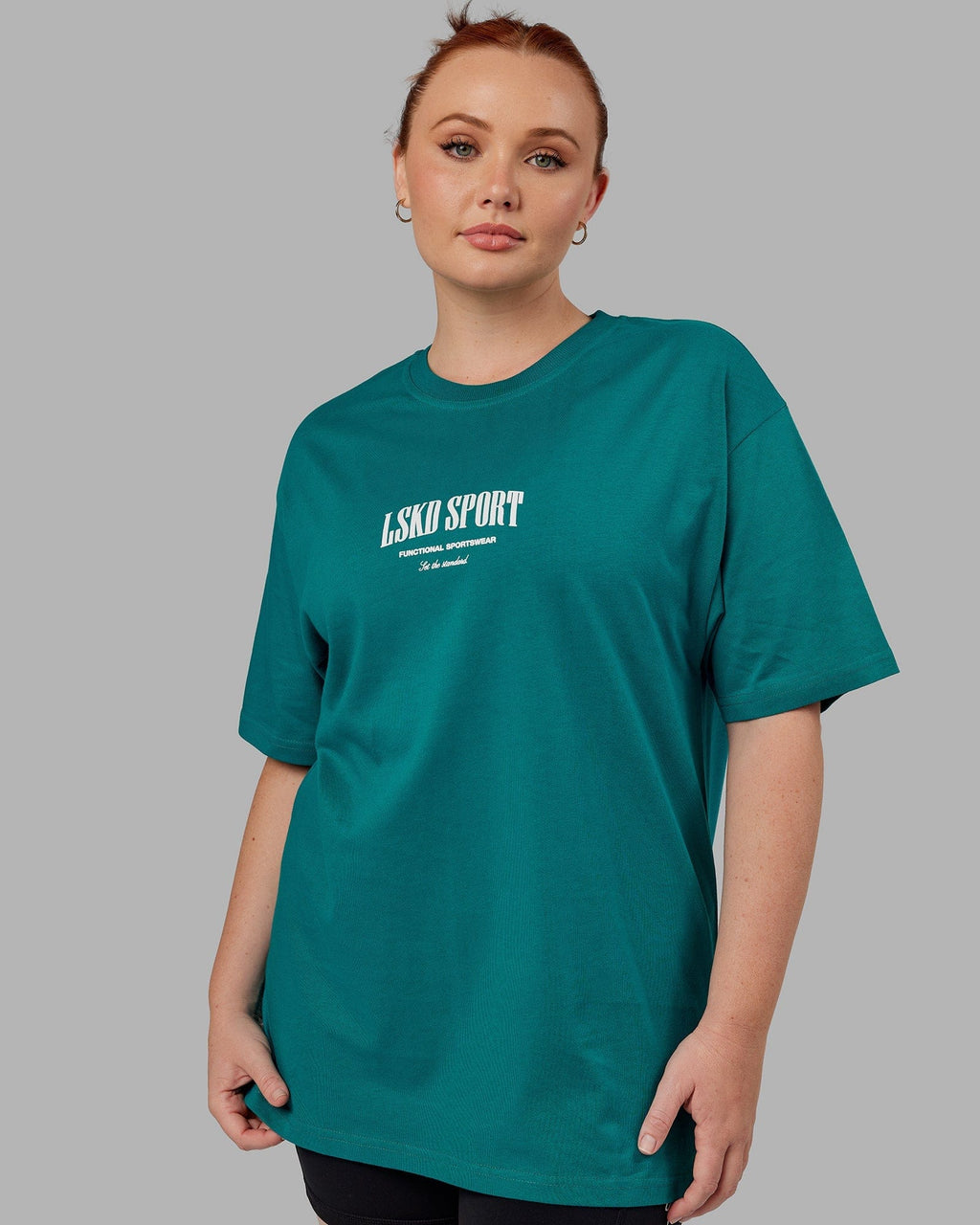 Model wearing Unisex Standard Heavyweight Tee Oversize - Deep Lake