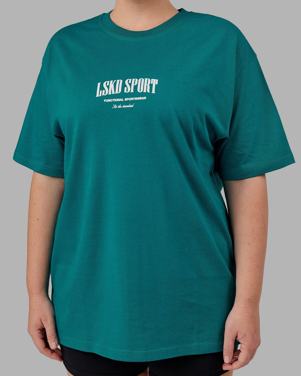 Model wearing Unisex Standard Heavyweight Tee Oversize - Deep Lake