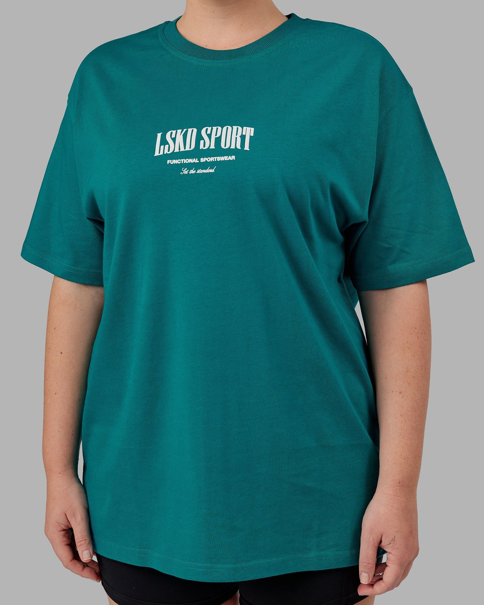 Model wearing Unisex Standard Heavyweight Tee Oversize - Deep Lake