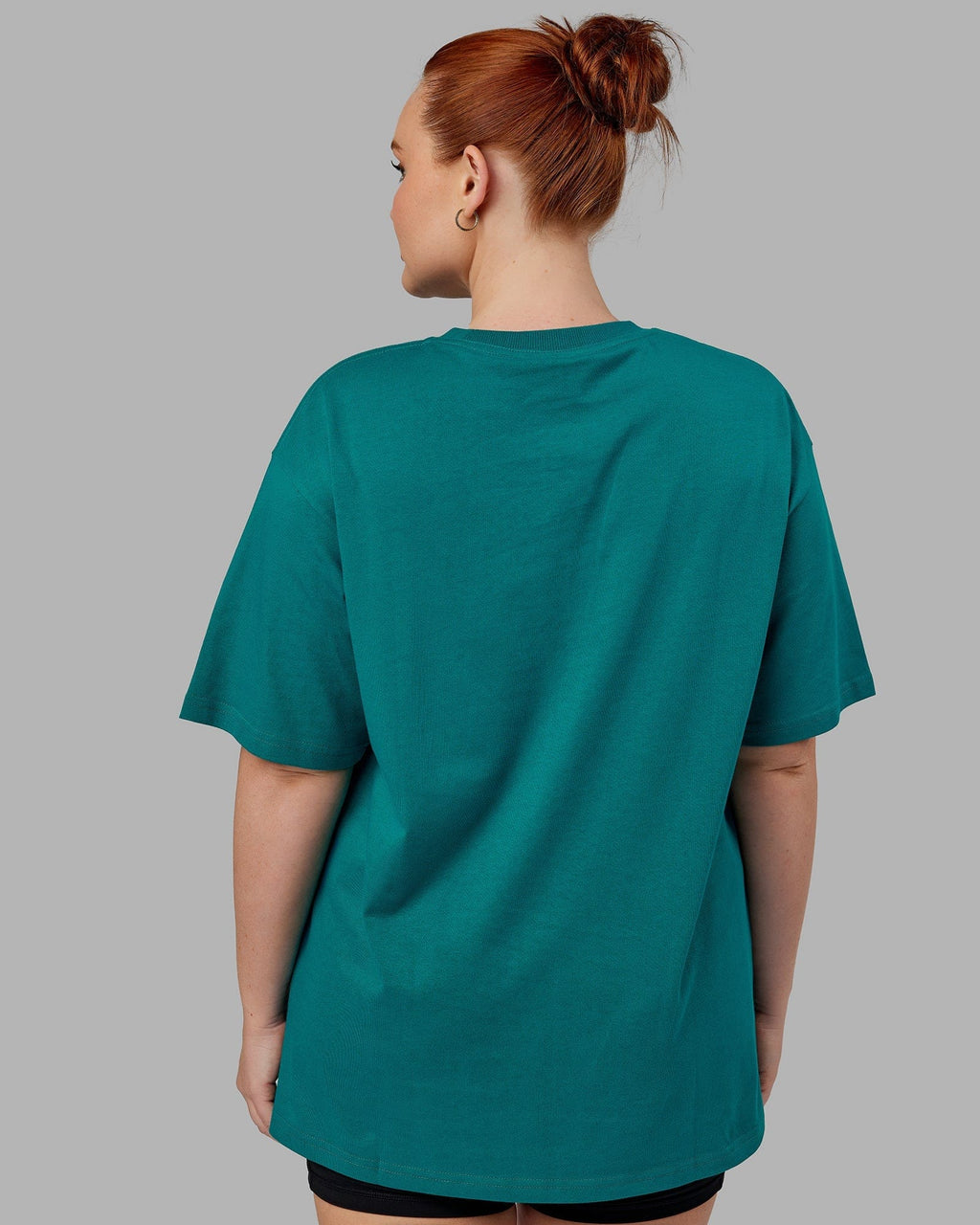 Model wearing Unisex Standard Heavyweight Tee Oversize - Deep Lake