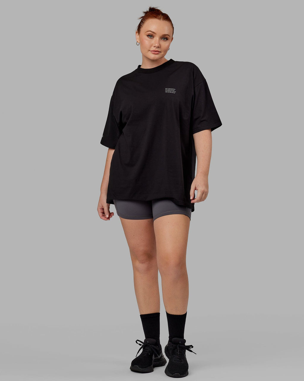 Model wearing Unisex Strive FLXCotton Tee Oversize - Black-White