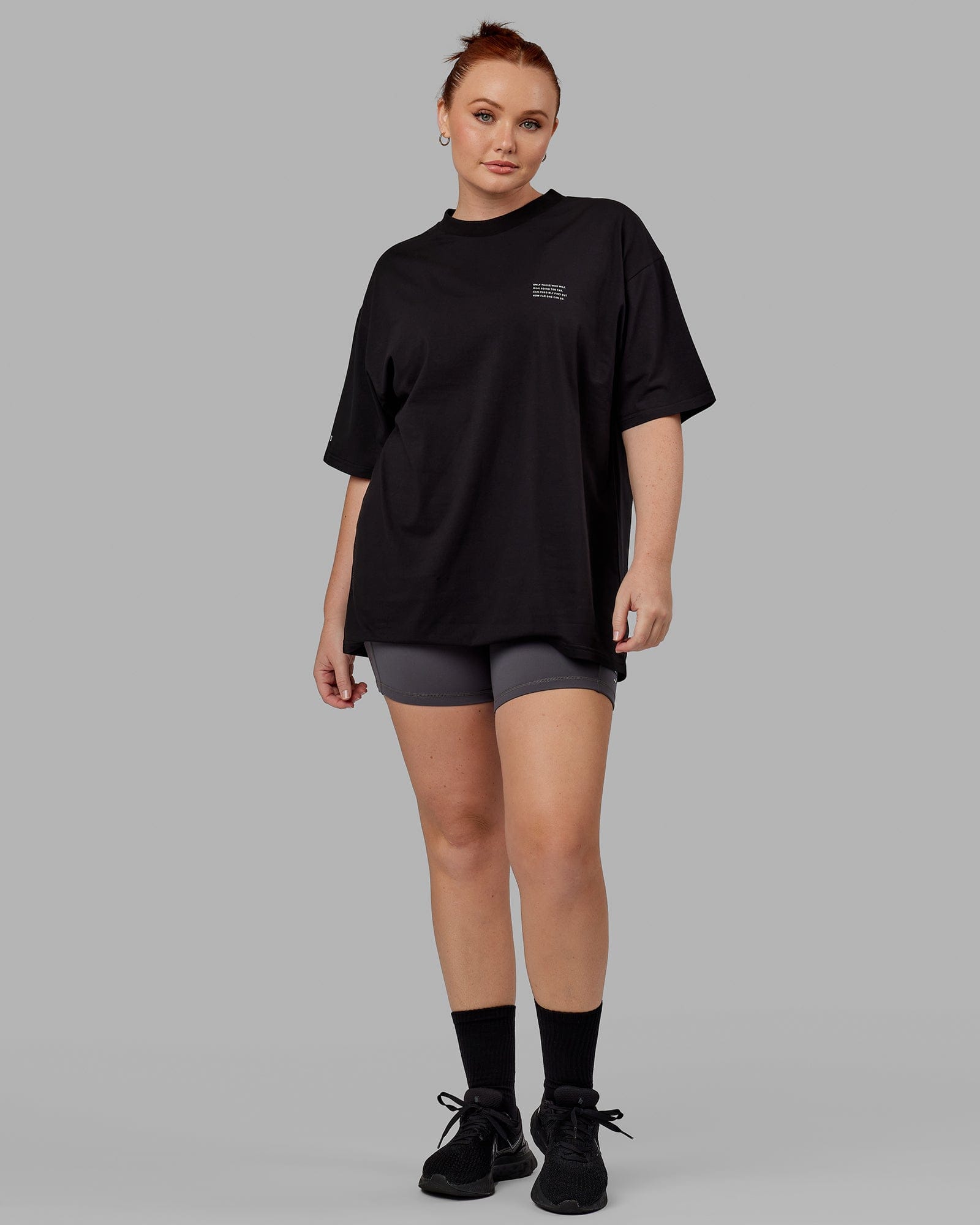 Model wearing Unisex Strive FLXCotton Tee Oversize - Black-White