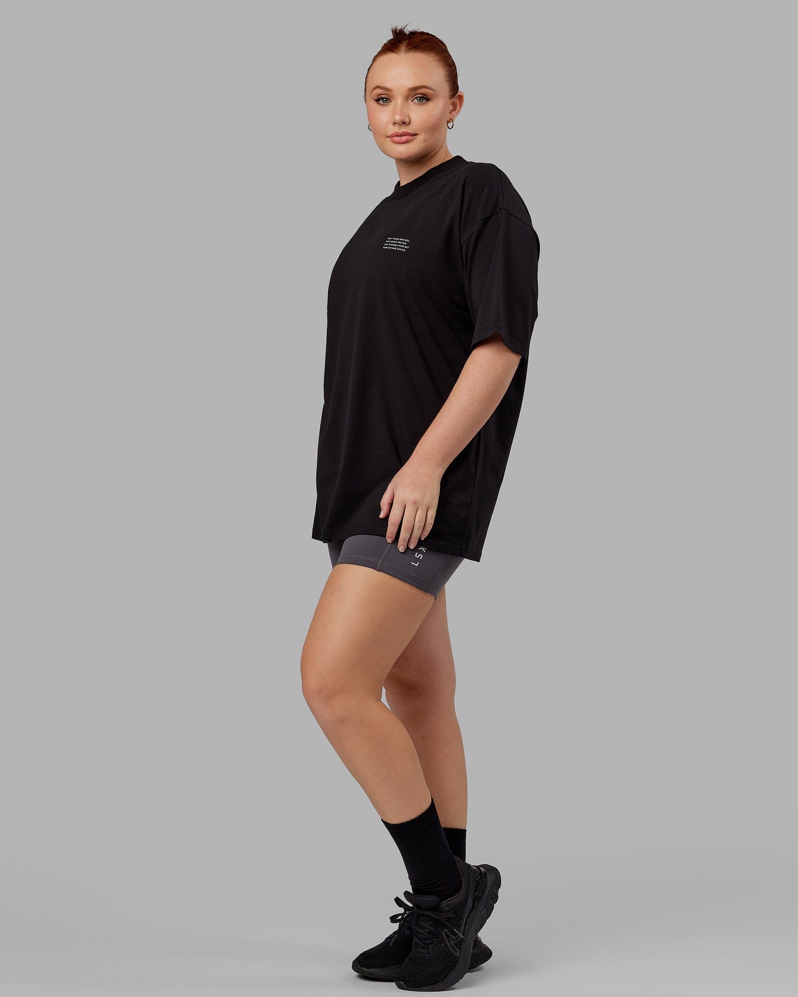Model wearing Unisex Strive FLXCotton Tee Oversize - Black-White