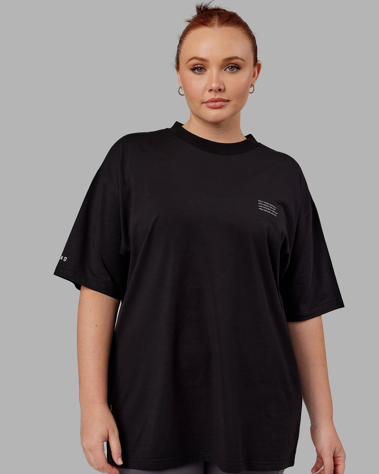 Model wearing Unisex Strive FLXCotton Tee Oversize - Black-White