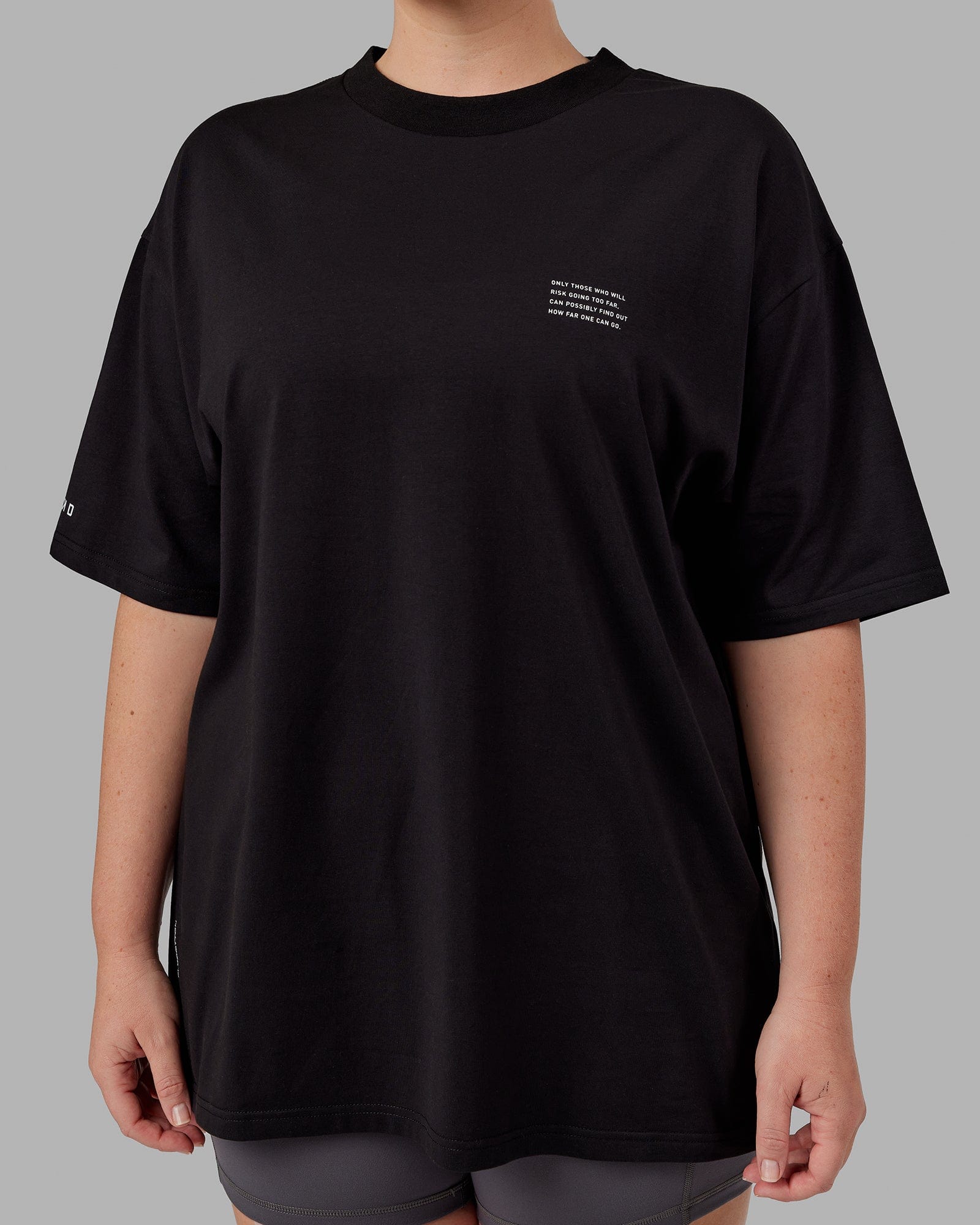 Model wearing Unisex Strive FLXCotton Tee Oversize - Black-White