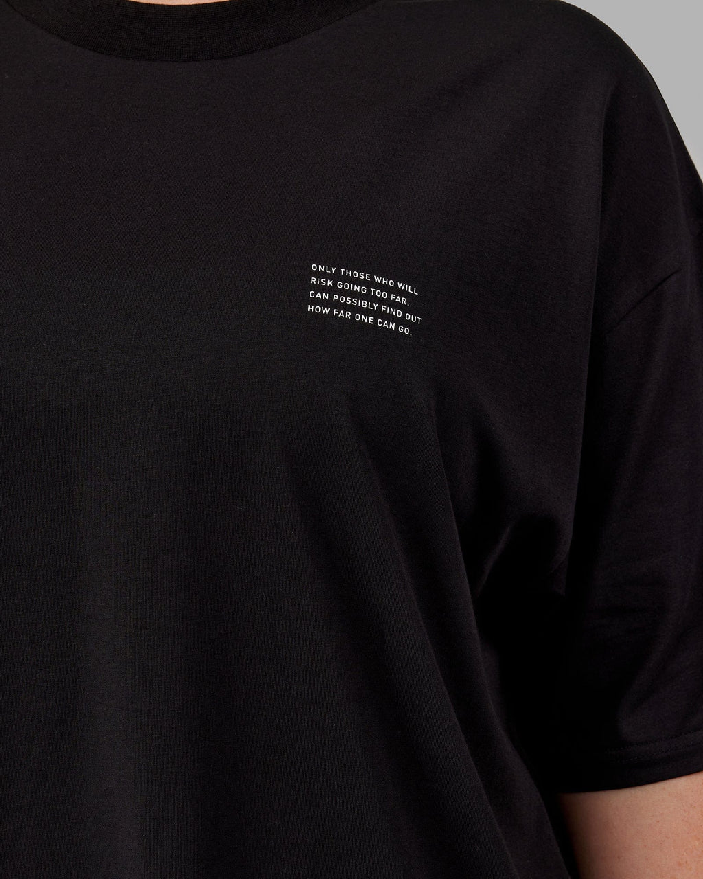 Model wearing Unisex Strive FLXCotton Tee Oversize - Black-White