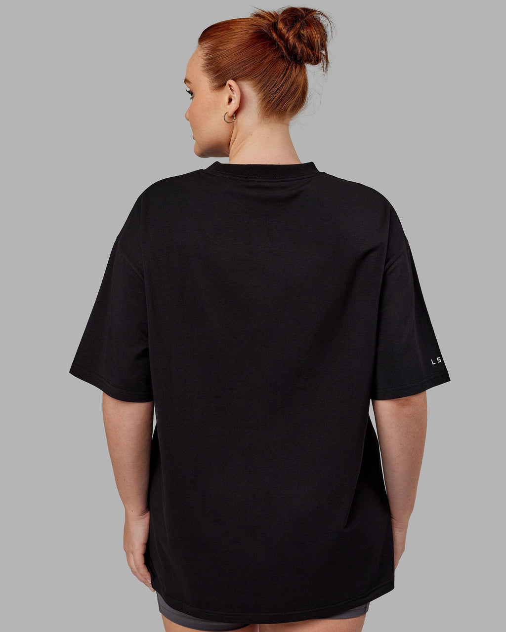 Model wearing Unisex Strive FLXCotton Tee Oversize - Black-White