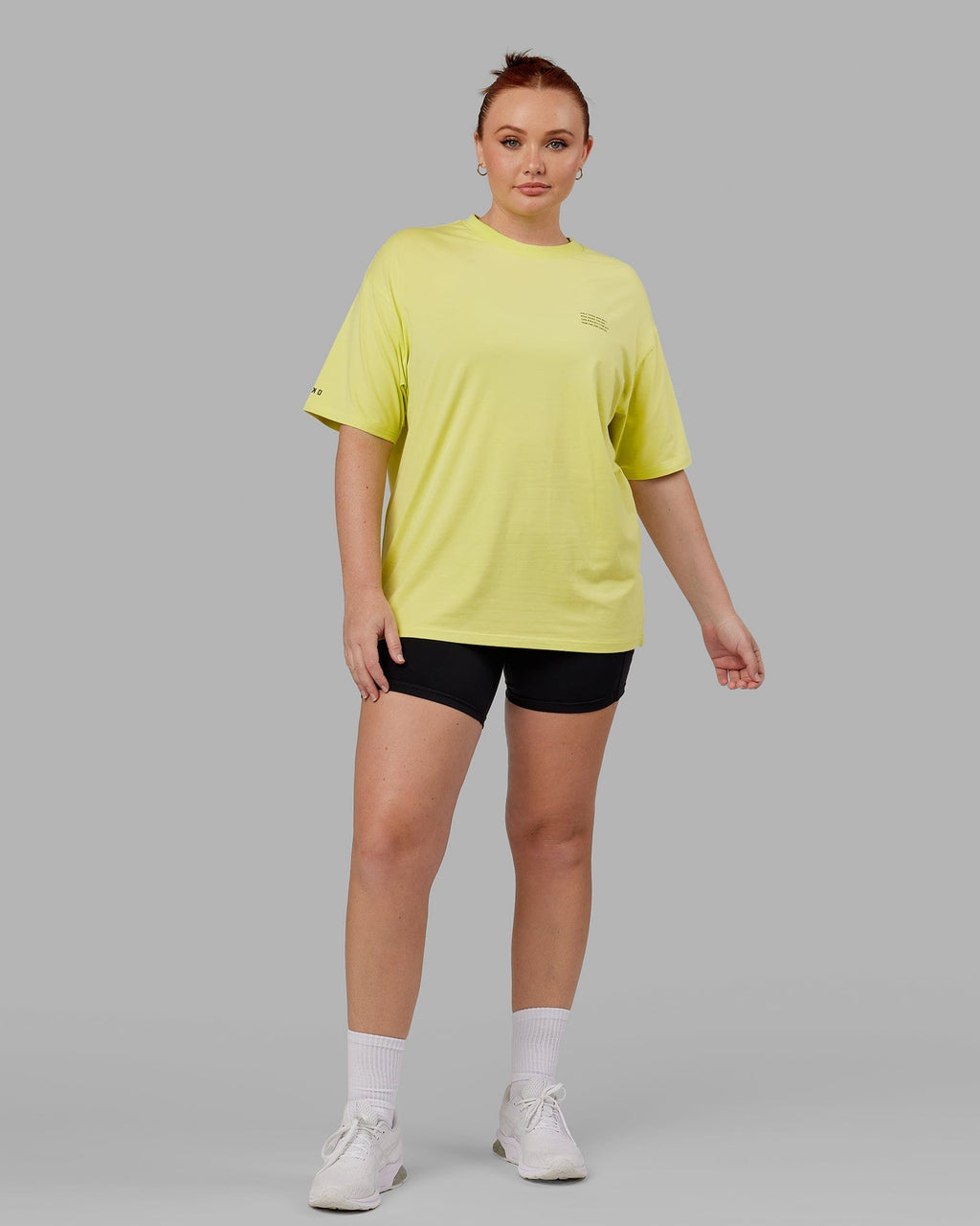 Model wearing Unisex Strive FLXCotton Tee Oversize - Citrus Green