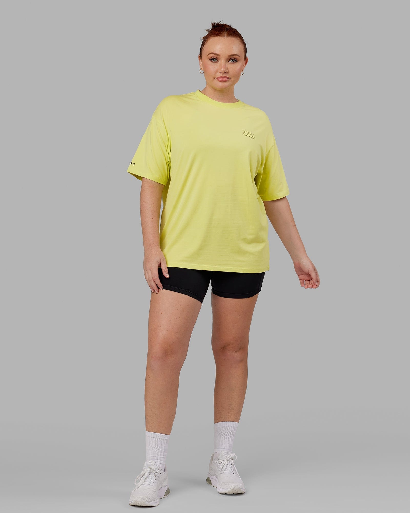 Model wearing Unisex Strive FLXCotton Tee Oversize - Citrus Green