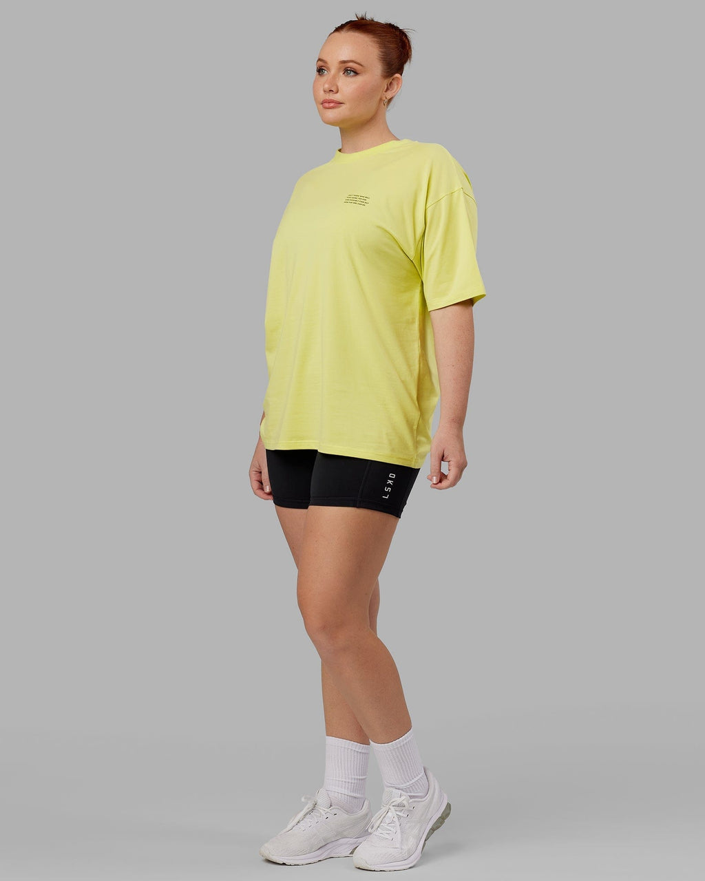 Model wearing Unisex Strive FLXCotton Tee Oversize - Citrus Green