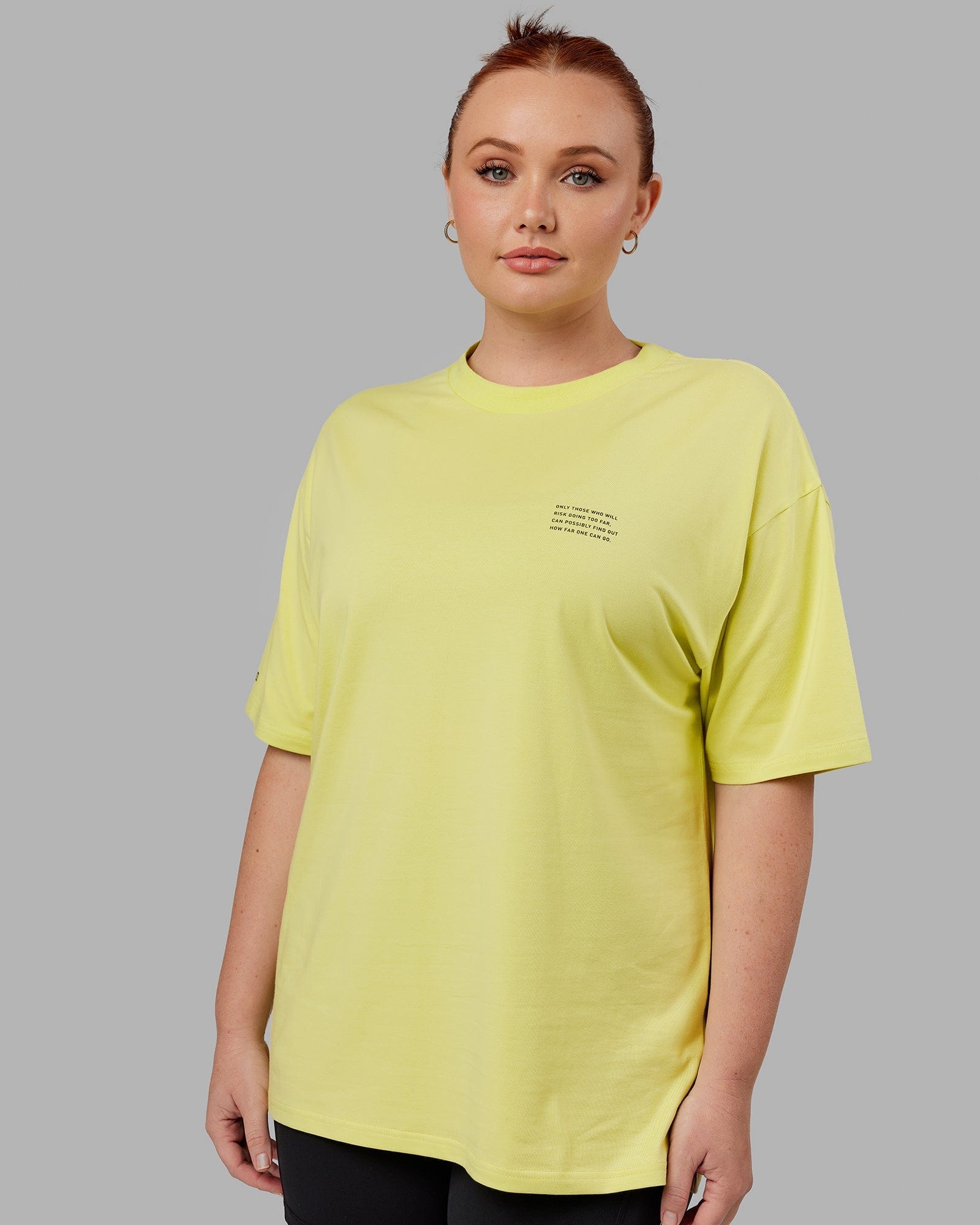 Model wearing Unisex Strive FLXCotton Tee Oversize - Citrus Green