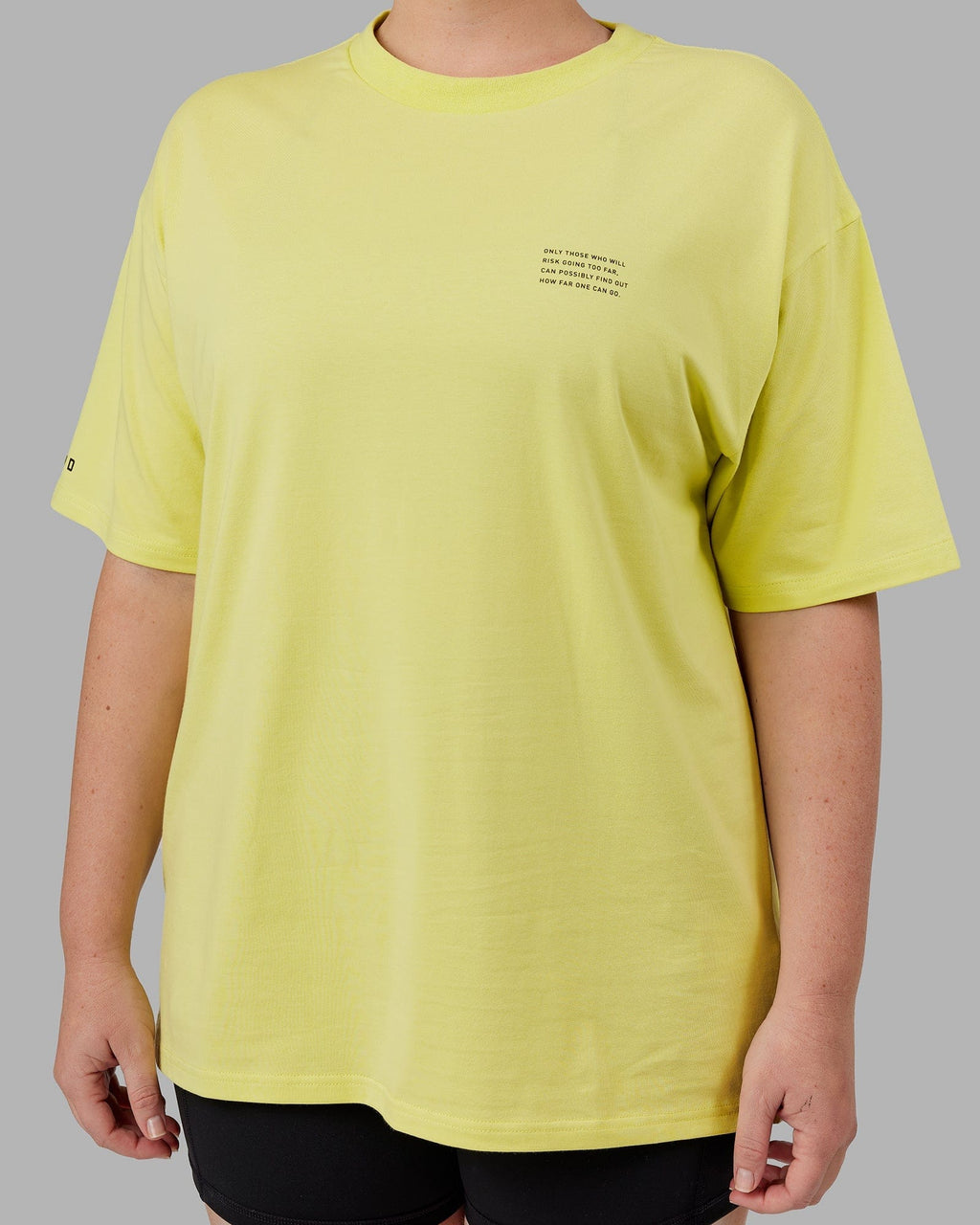 Model wearing Unisex Strive FLXCotton Tee Oversize - Citrus Green