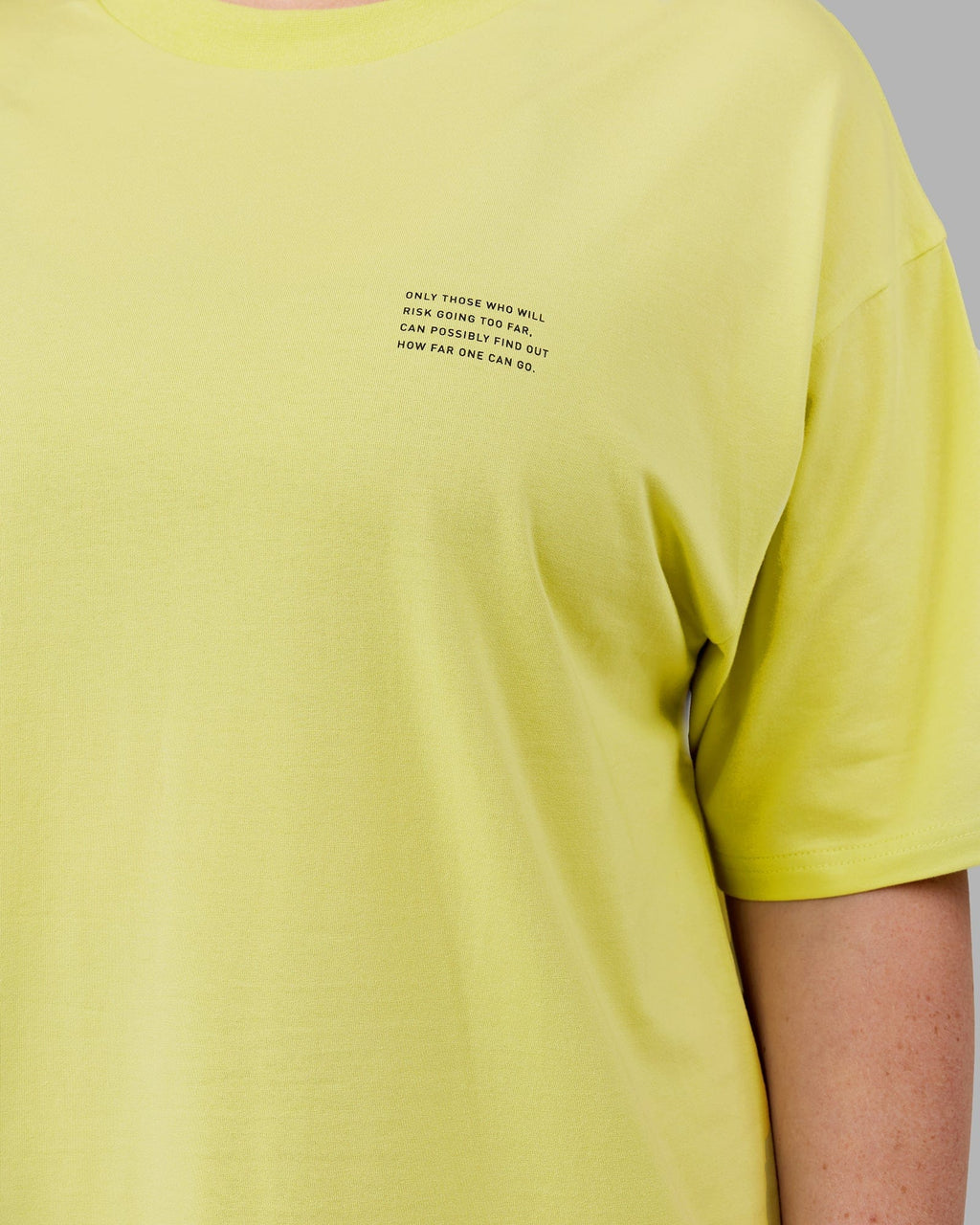 Model wearing Unisex Strive FLXCotton Tee Oversize - Citrus Green
