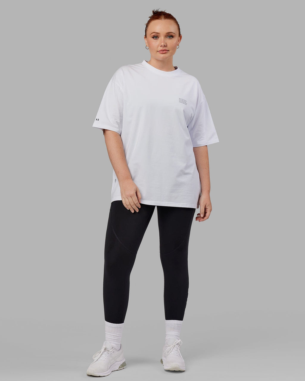 Model wearing Unisex Strive FLXCotton Tee Oversize - White