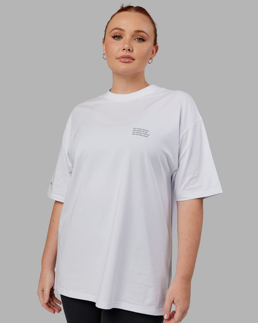 Model wearing Unisex Strive FLXCotton Tee Oversize - White