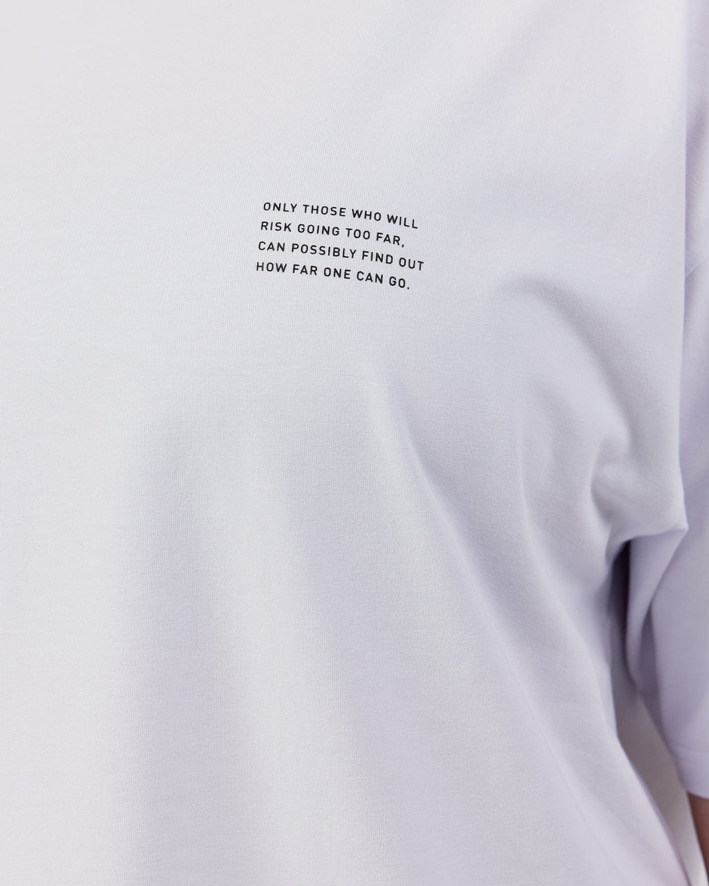 Model wearing Unisex Strive FLXCotton Tee Oversize - White