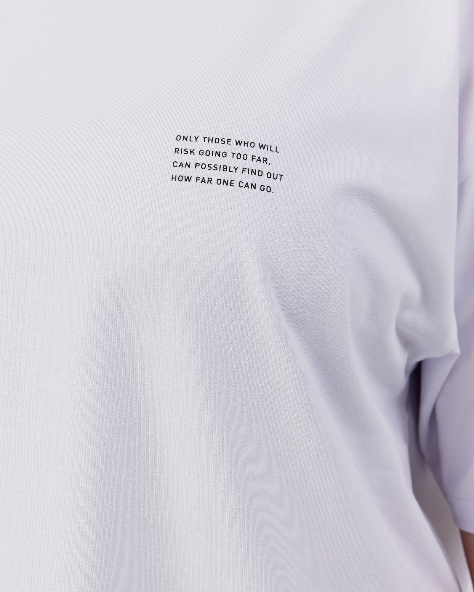 Model wearing Unisex Strive FLXCotton Tee Oversize - White