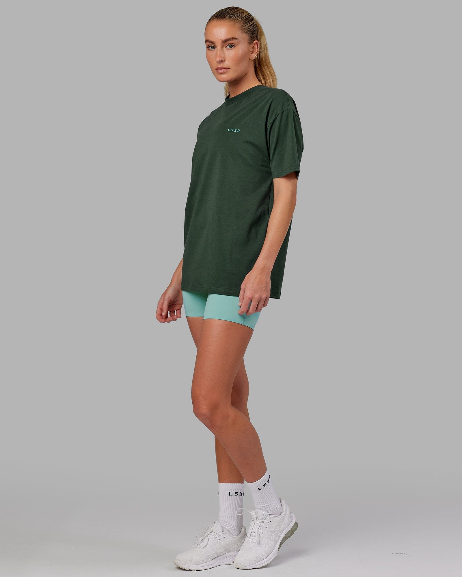 Model wearing Unisex VS2 FLXCotton Tee Oversize - Vital Green-Teal
