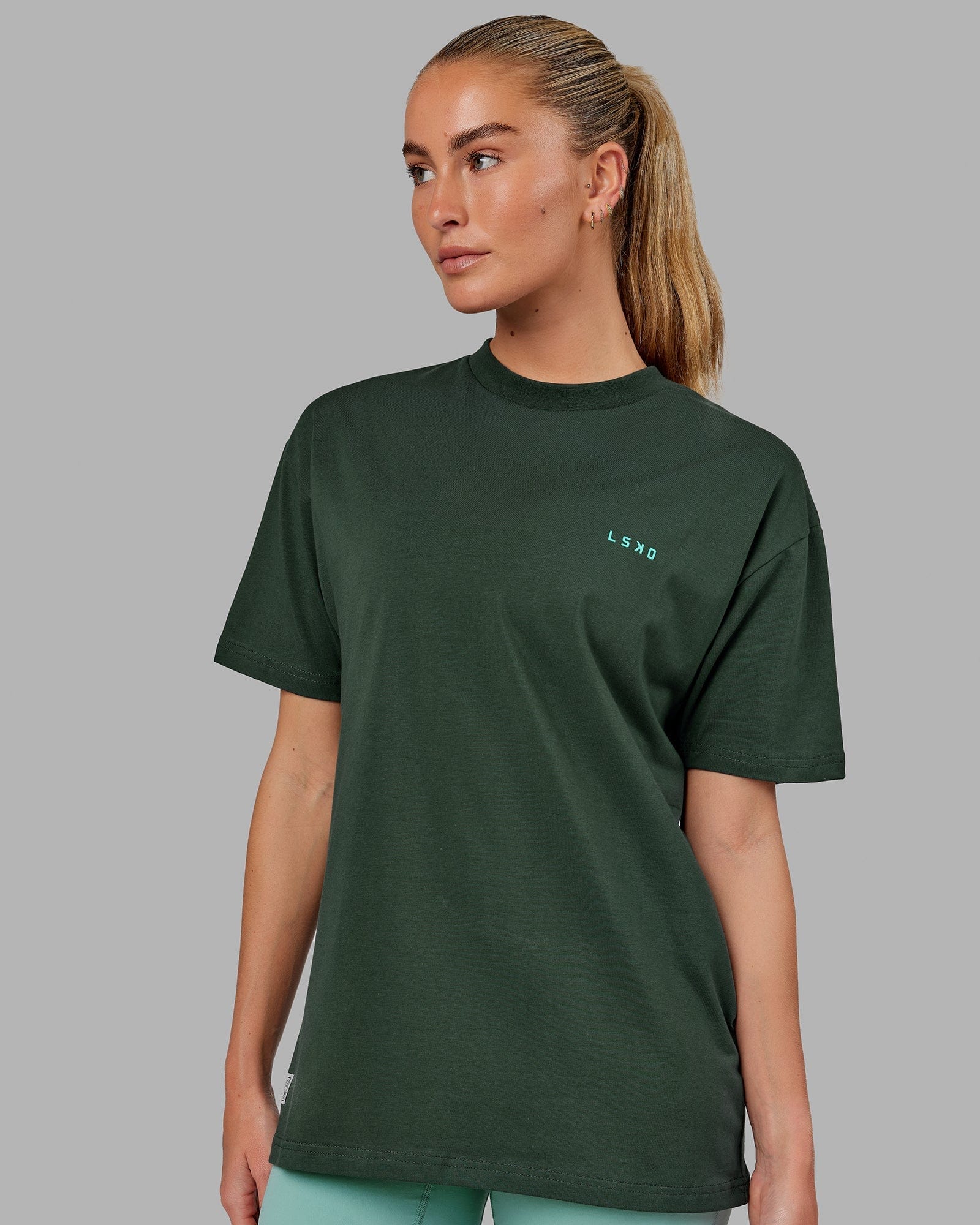 Model wearing Unisex VS2 FLXCotton Tee Oversize - Vital Green-Teal