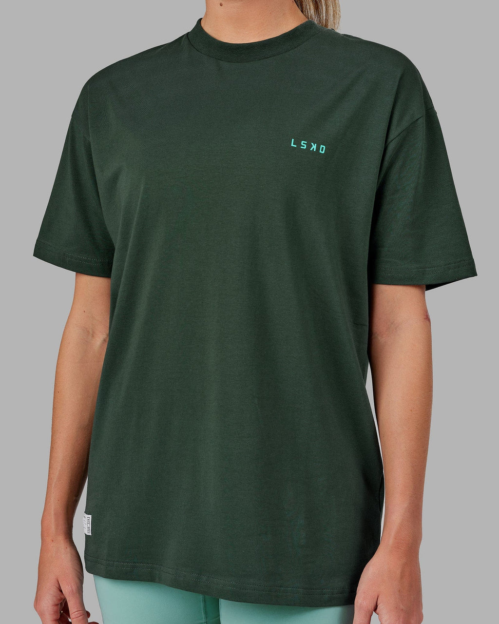 Model wearing Unisex VS2 FLXCotton Tee Oversize - Vital Green-Teal