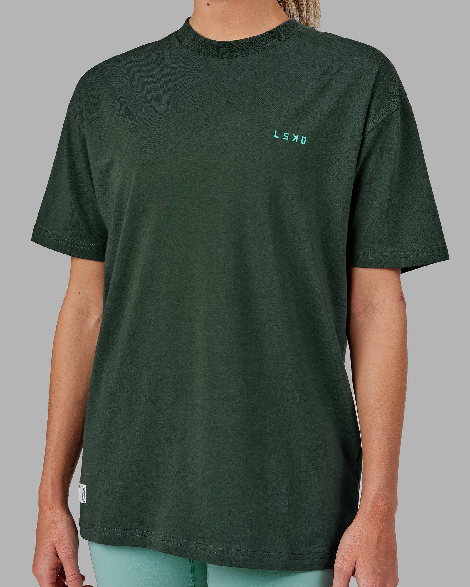 Model wearing Unisex VS2 FLXCotton Tee Oversize - Vital Green-Teal