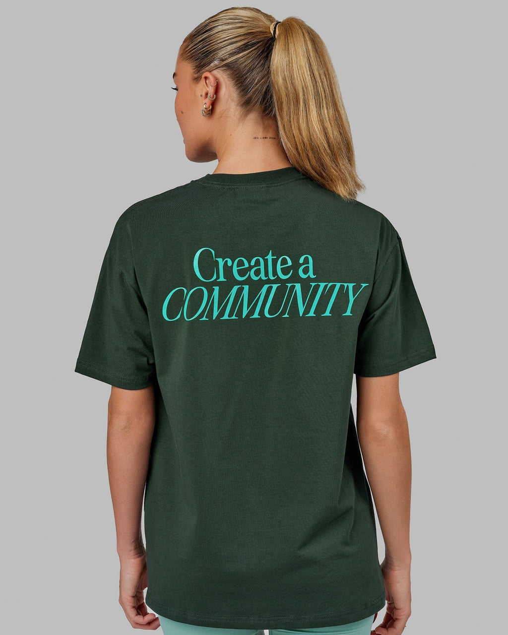 Model wearing Unisex VS2 FLXCotton Tee Oversize - Vital Green-Teal