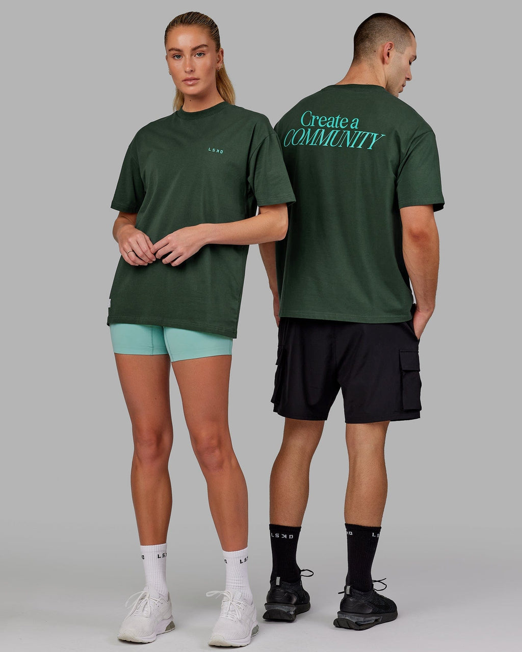Model wearing Unisex VS2 FLXCotton Tee Oversize - Vital Green-Teal