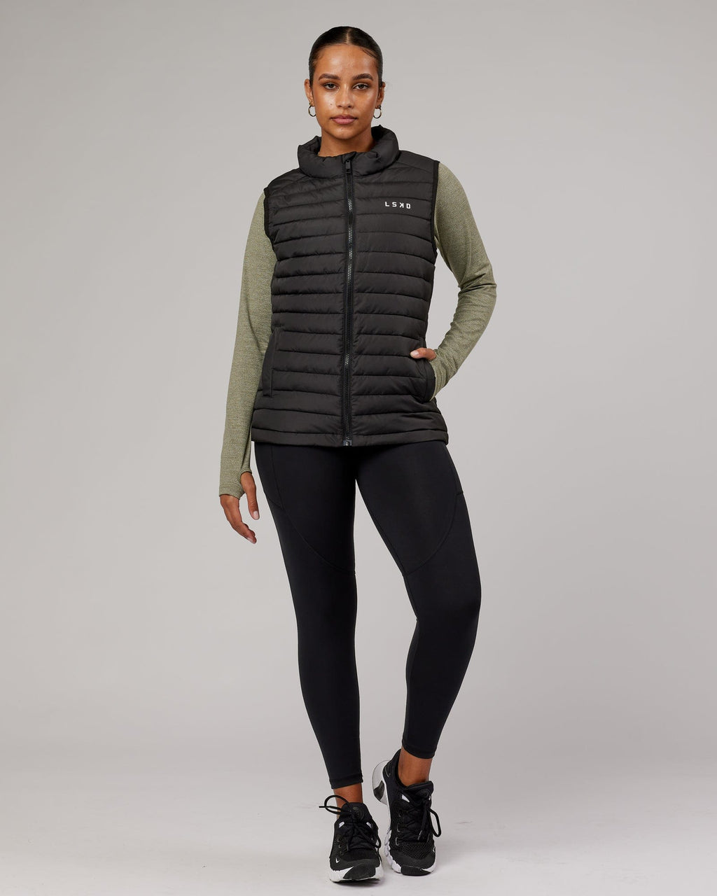 Model wearing Uplift Puffer Vest - Black Fade