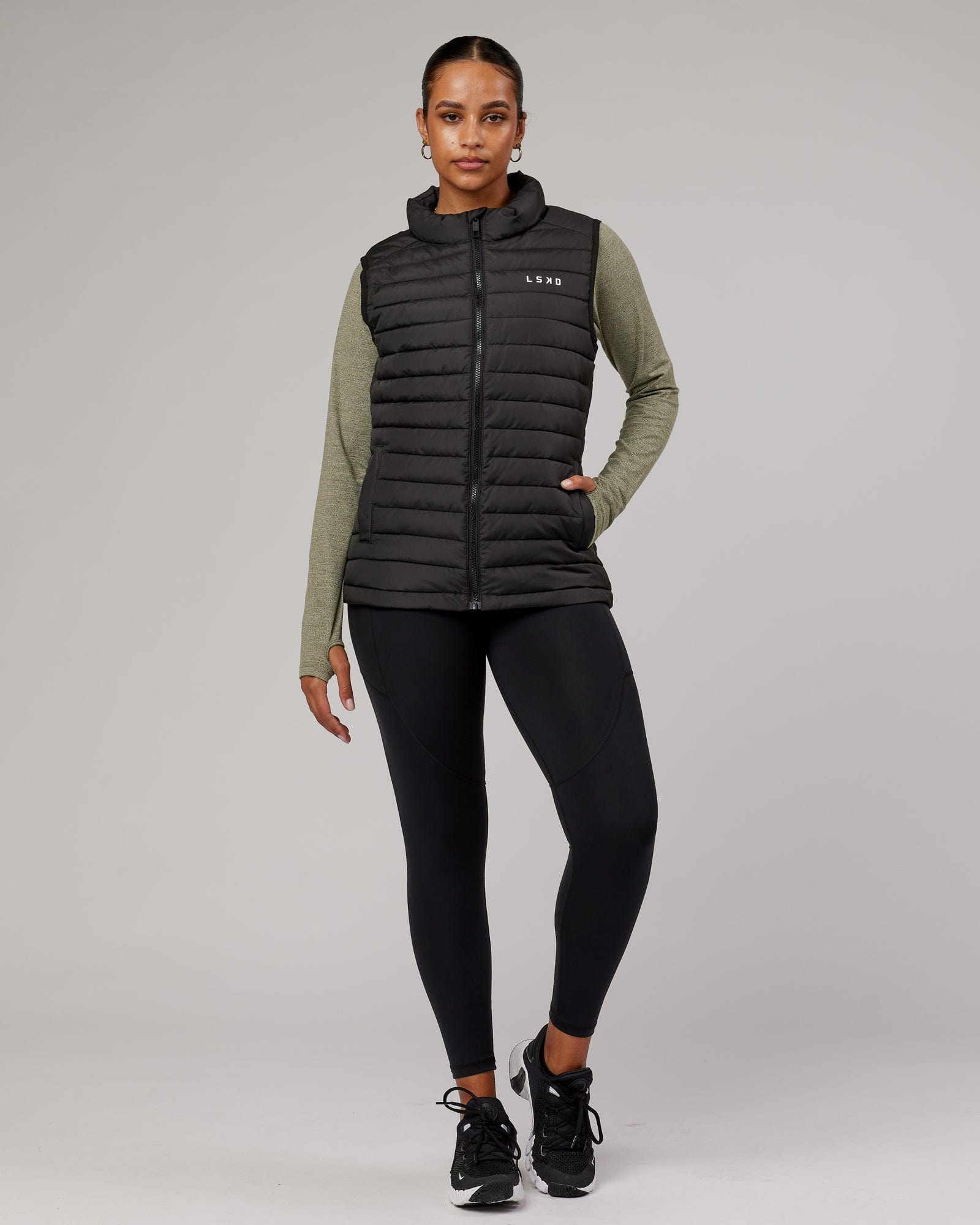 Model wearing Uplift Puffer Vest - Black Fade