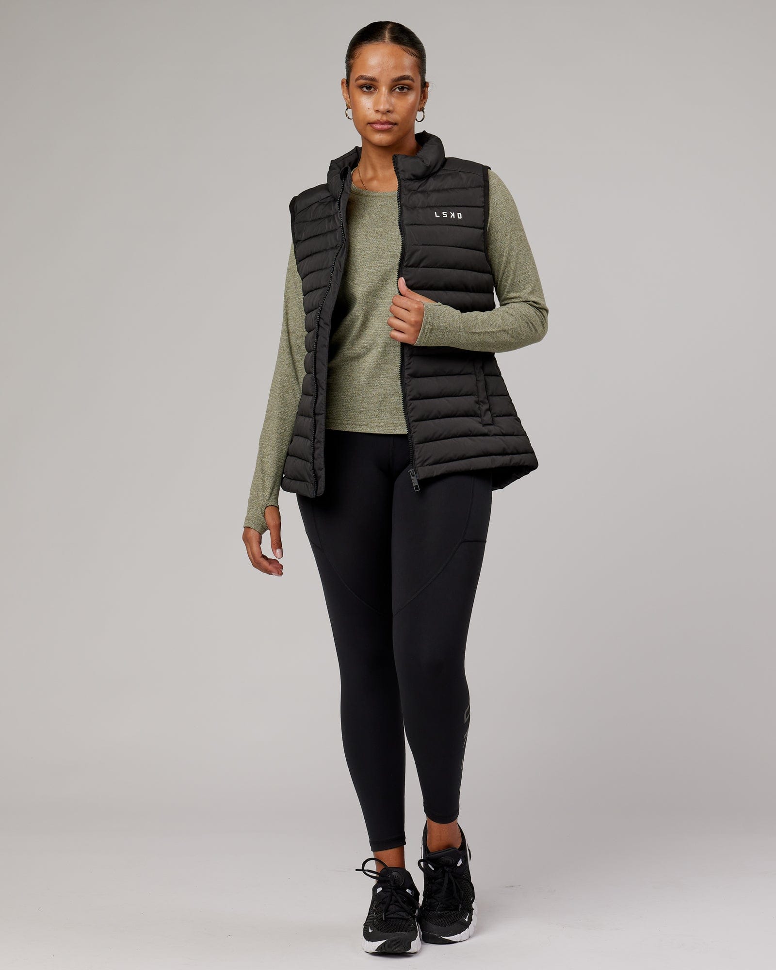 Model wearing Uplift Puffer Vest - Black Fade