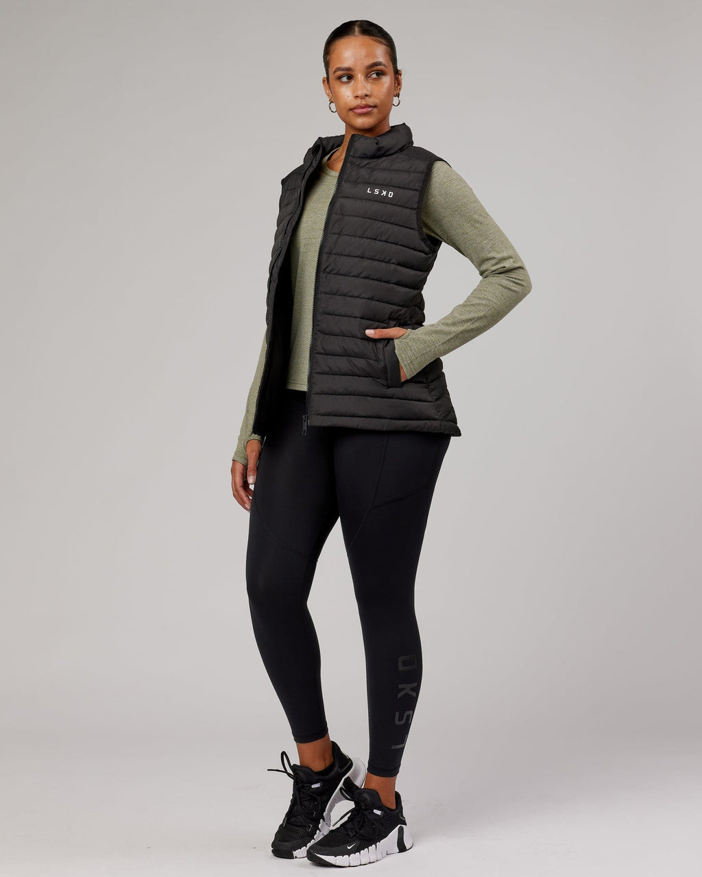 Model wearing Uplift Puffer Vest - Black Fade