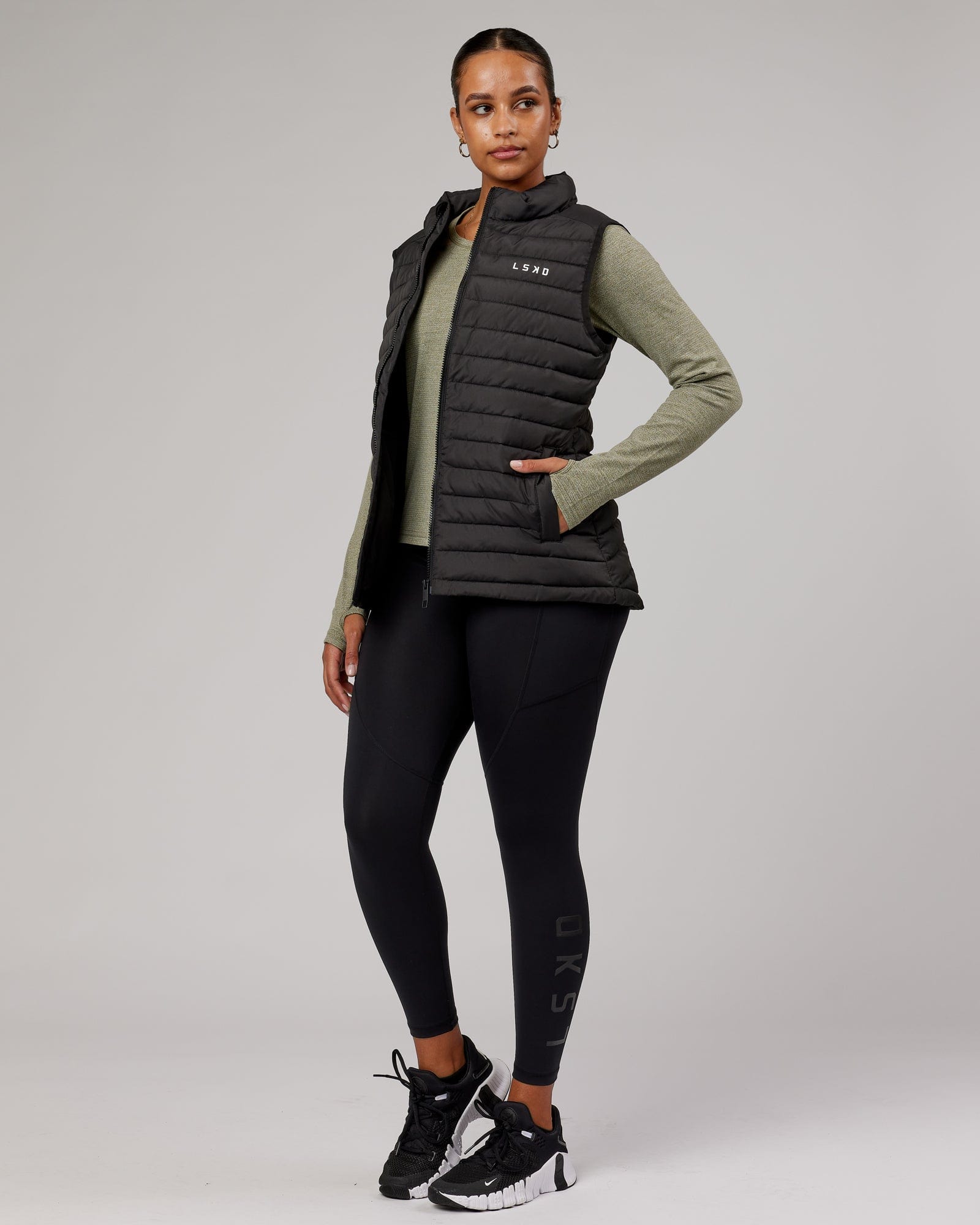 Model wearing Uplift Puffer Vest - Black Fade