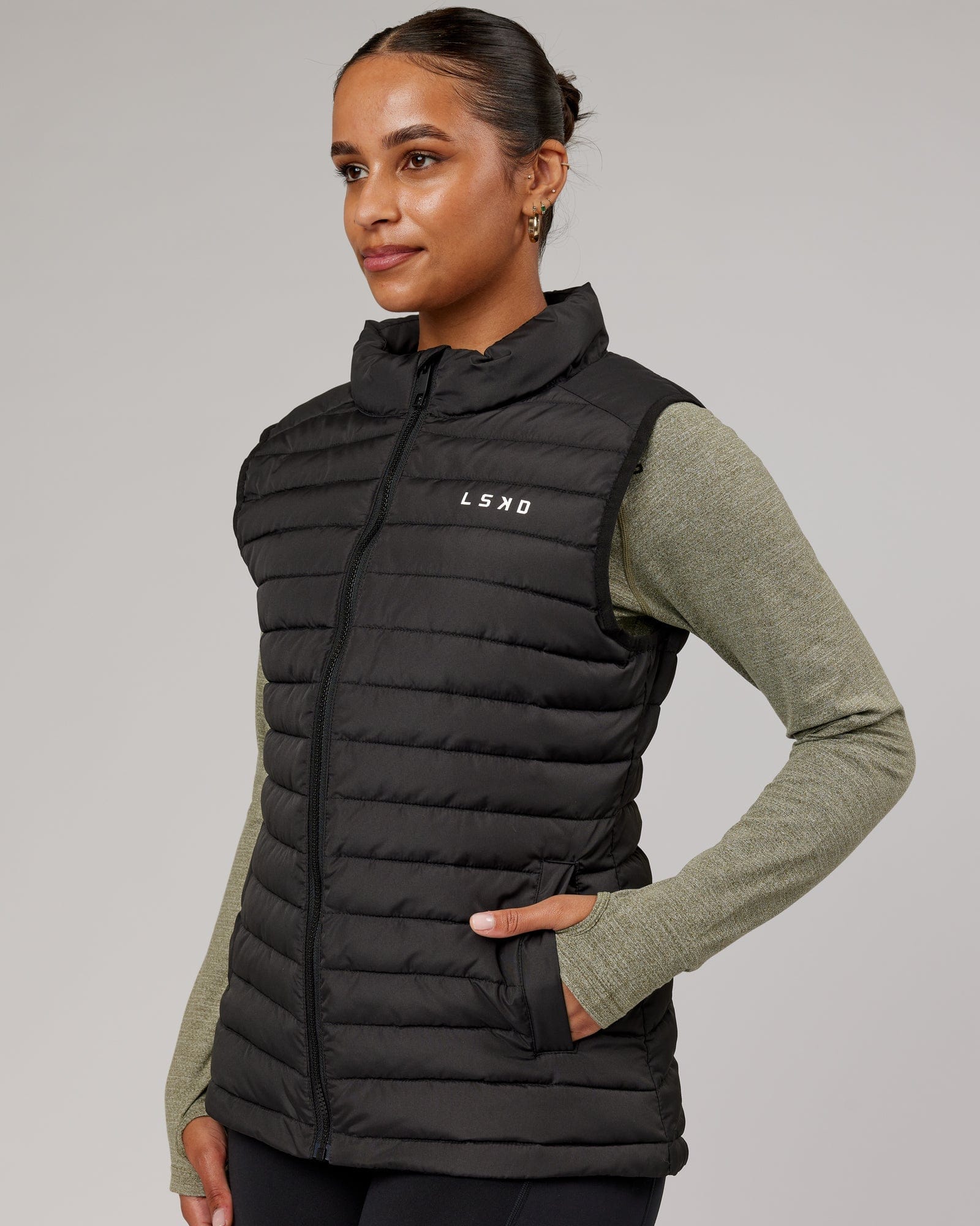 Model wearing Uplift Puffer Vest - Black Fade