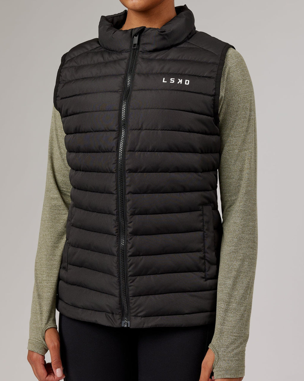 Model wearing Uplift Puffer Vest - Black Fade