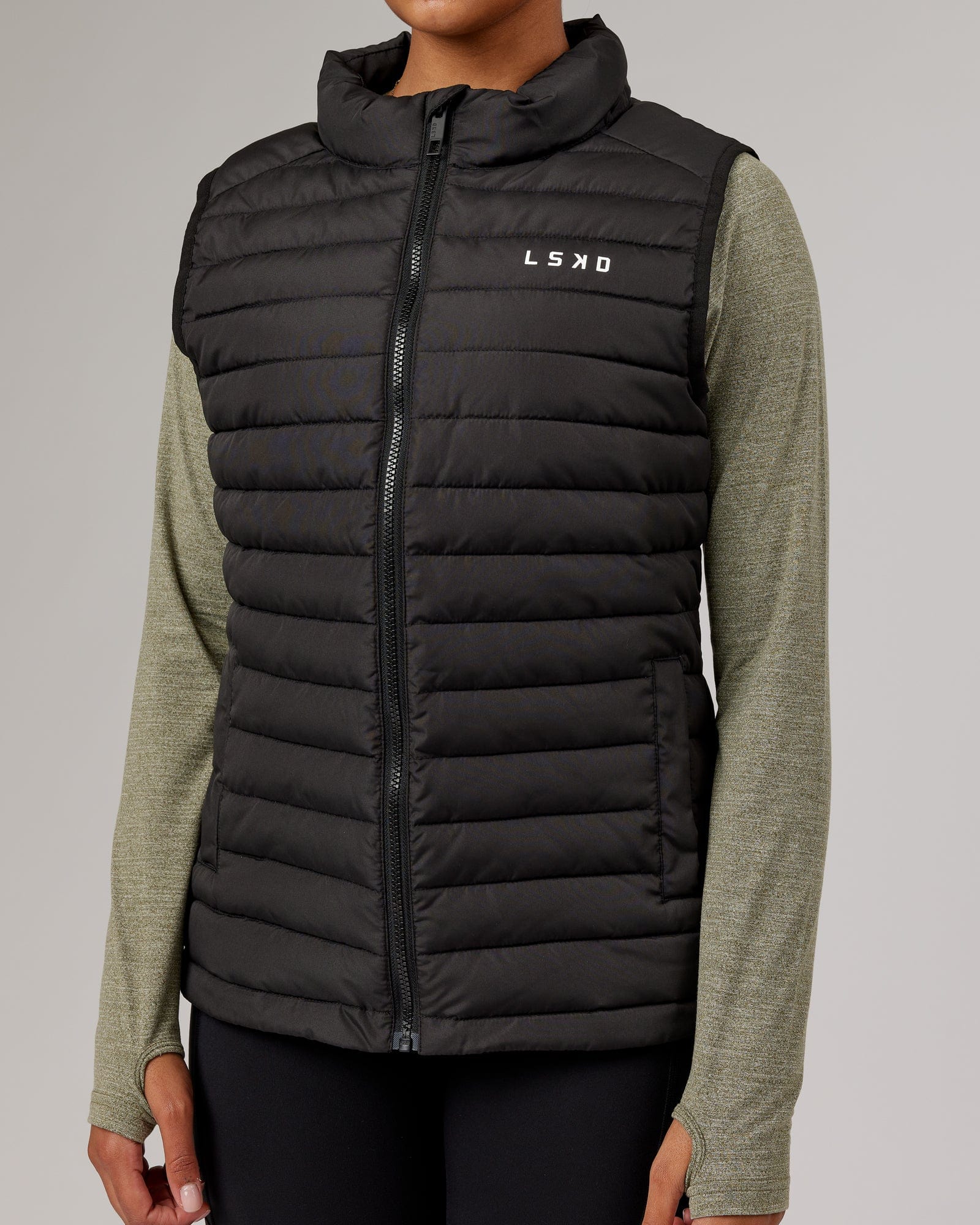 Model wearing Uplift Puffer Vest - Black Fade