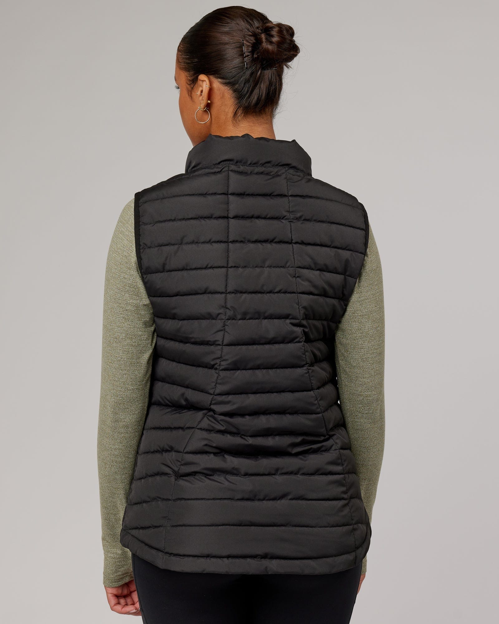 Model wearing Uplift Puffer Vest - Black Fade