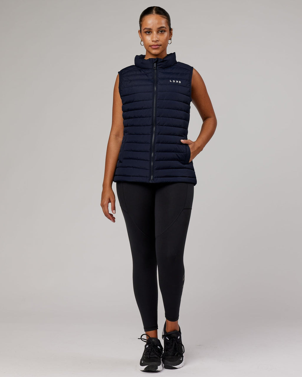 Model wearing Uplift Puffer Vest - Navy