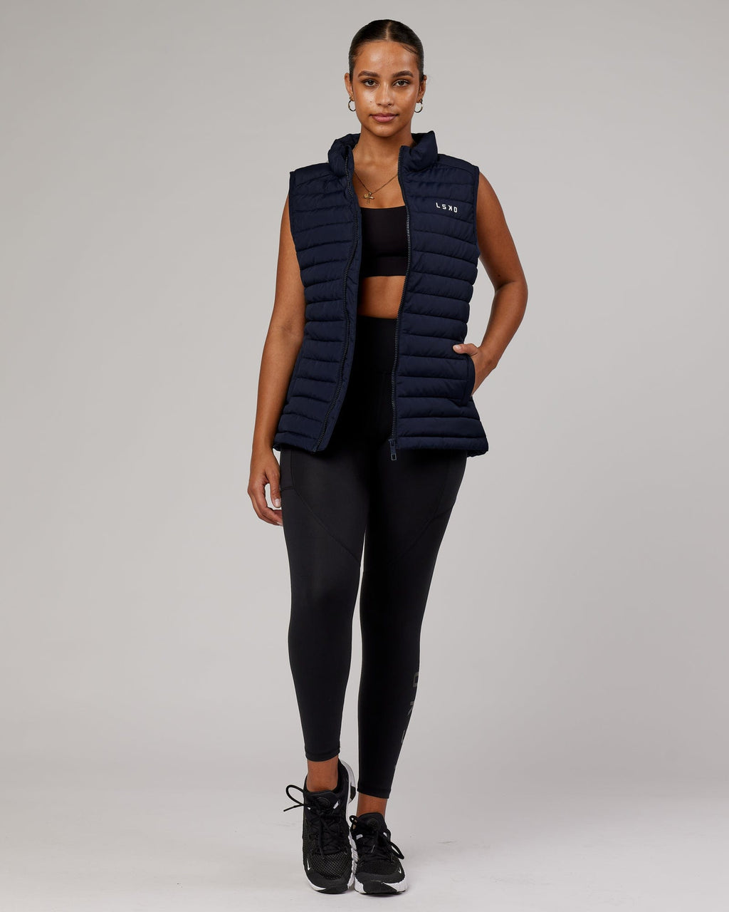 Model wearing Uplift Puffer Vest - Navy